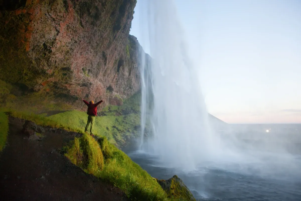 View from behind Seljalandsfoss waterfall in Iceland