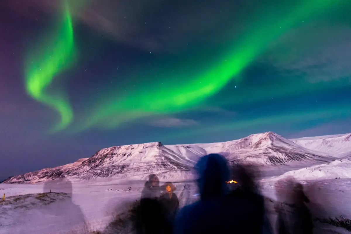 Aurora borealis dancing across the Icelandic night sky