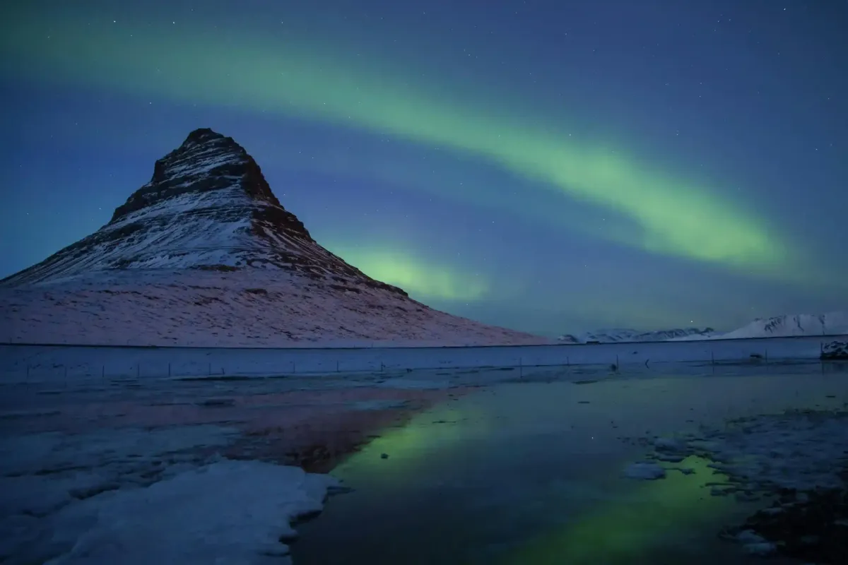 Northern lights over Kirkjufell mountain in Iceland
